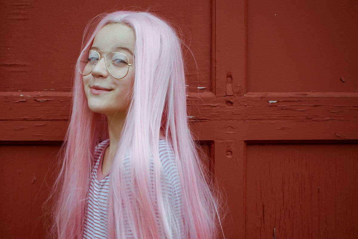 Young girl with long rose white hair